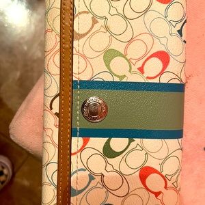 Coach wallet Been in a drawer for a few years never really used it.